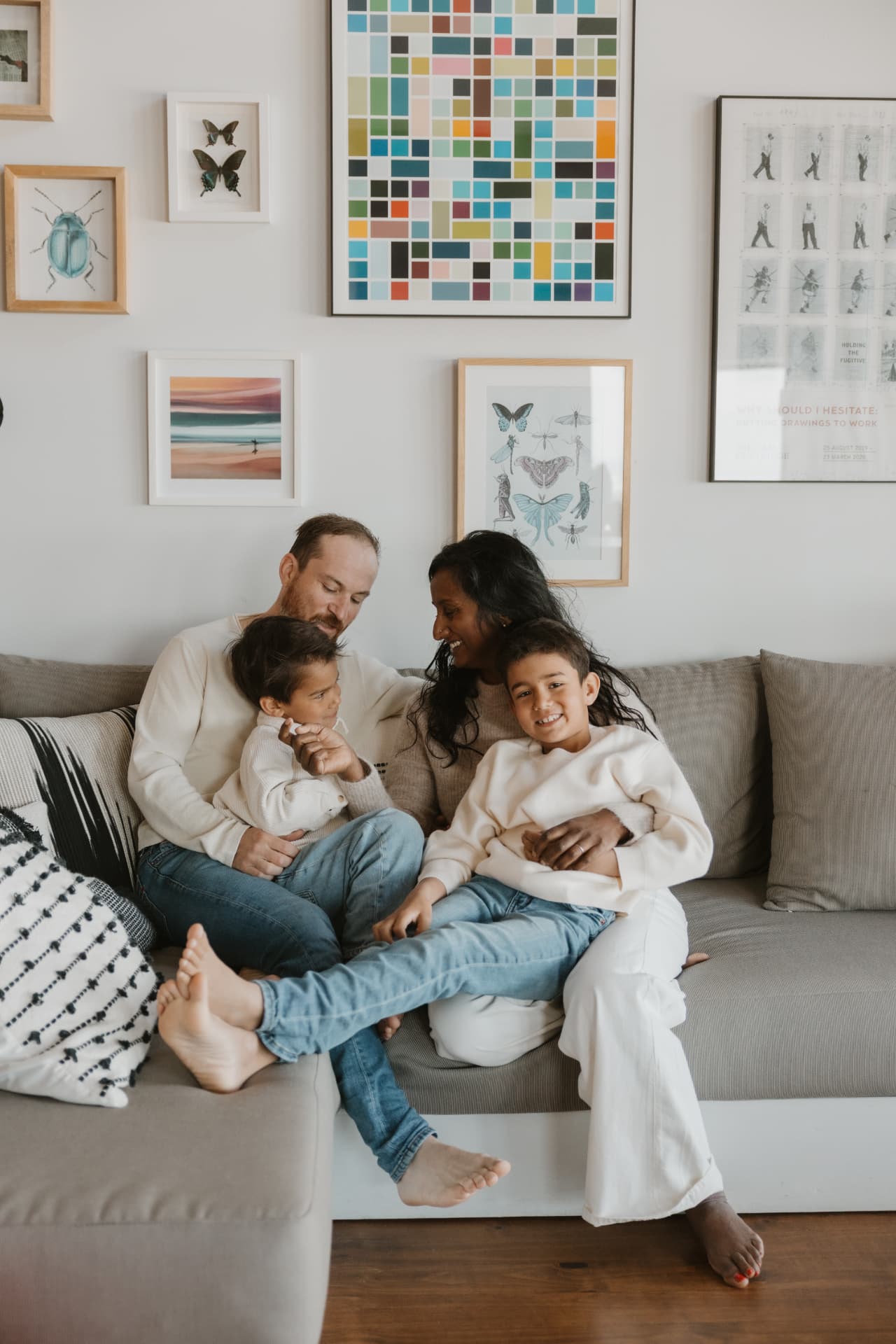 Family of four on the couch at home