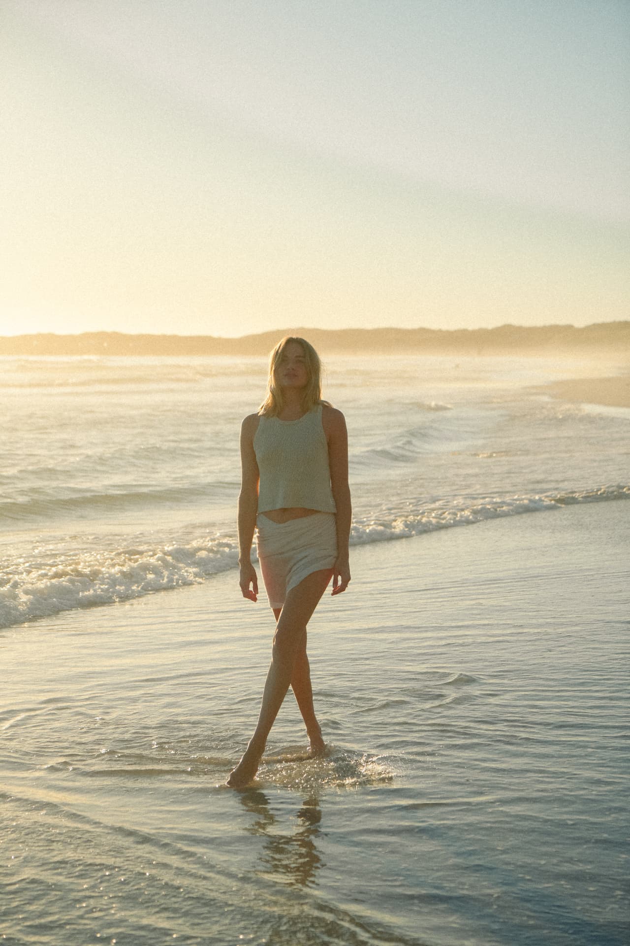 Woman photographed outdoors in warm light